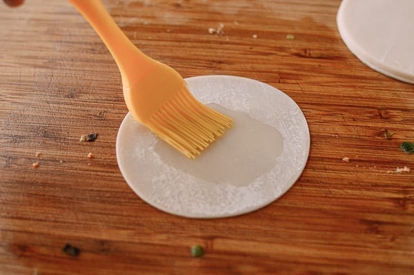 Brushing dumpling wrapper with oil, jcghk.dfhdjkvfj.cf