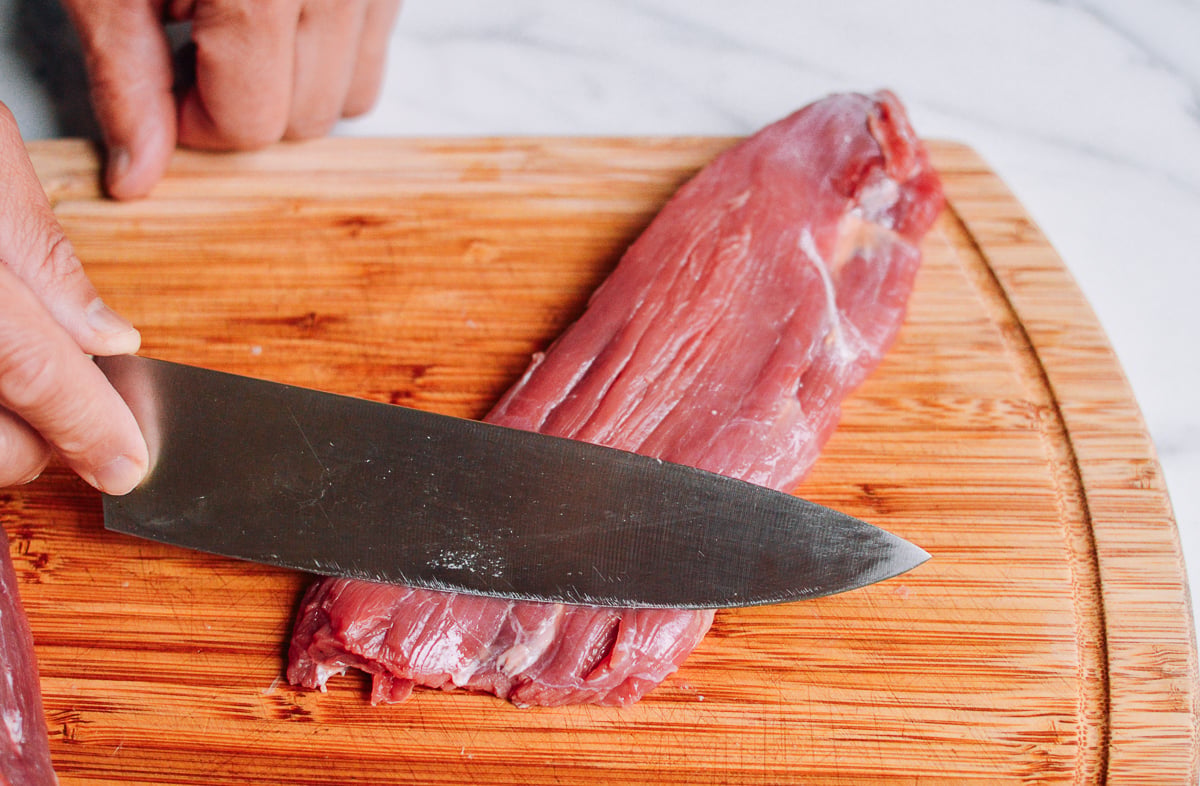 beef flank steak on a cutting board by jcghk.dfhdjkvfj.cf