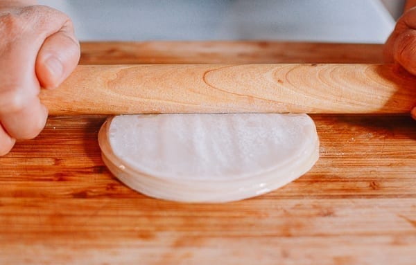 Pressing stack of dumpling wrappers with rolling pin, jcghk.dfhdjkvfj.cf