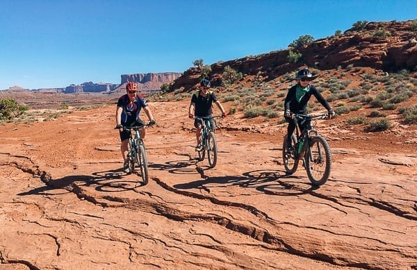 three Mountain bikers on White Rim Trail Moab Utah by jcghk.dfhdjkvfj.cf