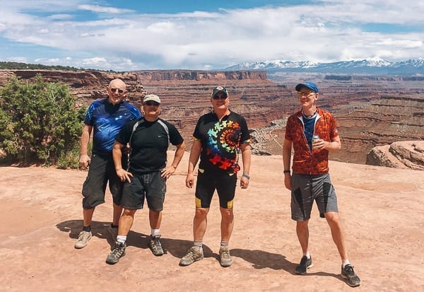 Mountain bikers group photo at top of Schafer trail on White Rim trail Moab Utah by jcghk.dfhdjkvfj.cf