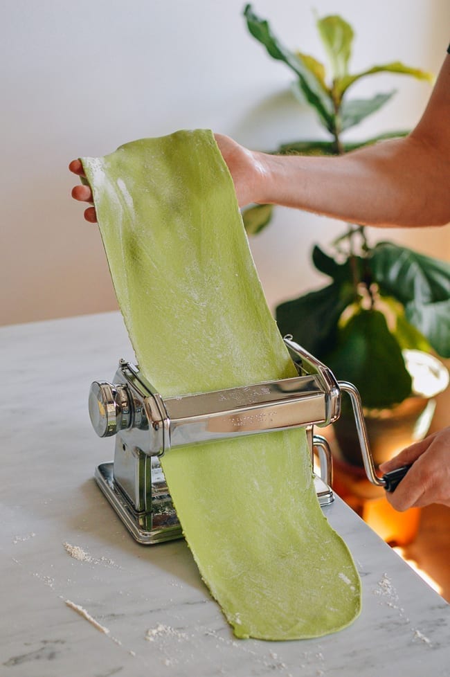Rolling spinach pasta dough through pasta roller, jcghk.dfhdjkvfj.cf