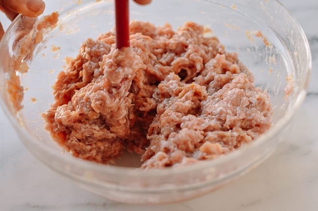 Stirring Chinese meat mixture until it resembles a paste, jcghk.dfhdjkvfj.cf