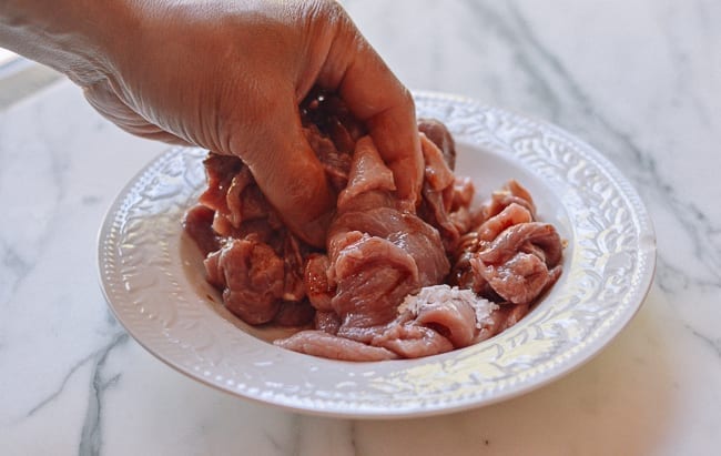 Massaging marinade ingredients into pork, jcghk.dfhdjkvfj.cf