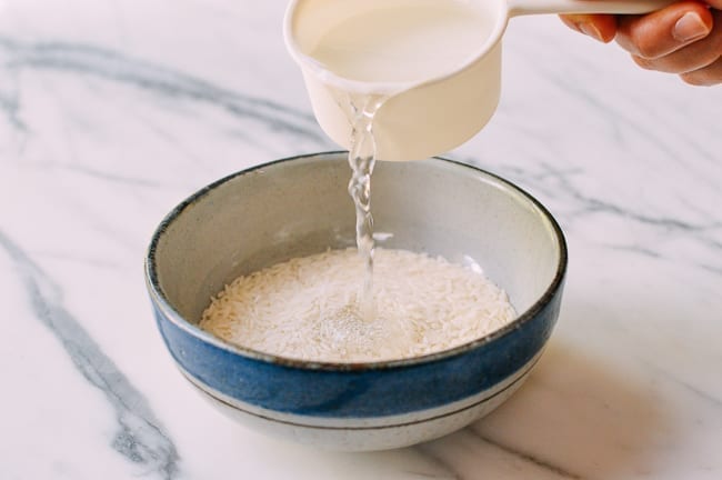 Adding water to rice in bowl, jcghk.dfhdjkvfj.cf
