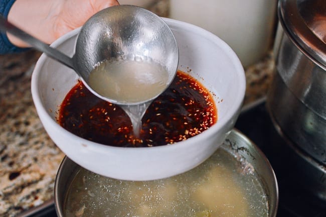 Adding hot stock to bowl of aromatics and seasonings, jcghk.dfhdjkvfj.cf