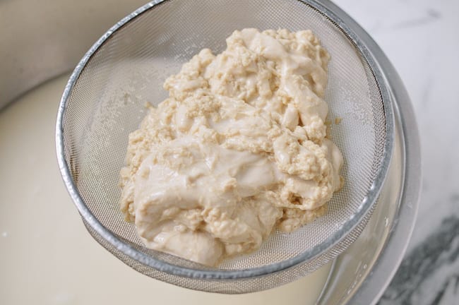 Pouring dough through fine-meshed strainer, jcghk.dfhdjkvfj.cf