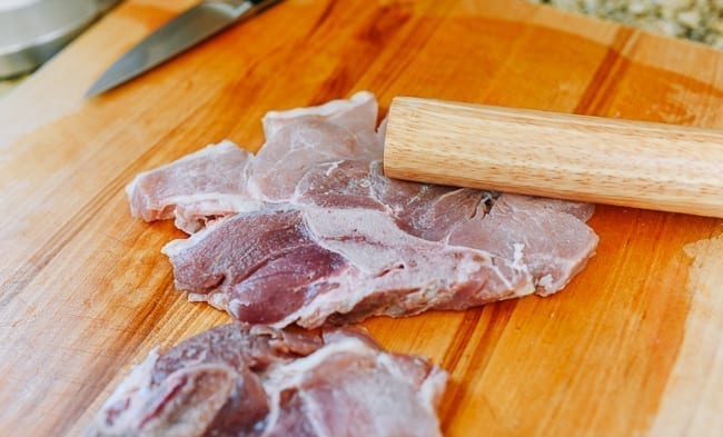 Pounding pork chops with rolling pin, jcghk.dfhdjkvfj.cf