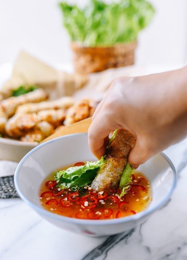 Dipping cha gio into nuoc cham, jcghk.dfhdjkvfj.cf
