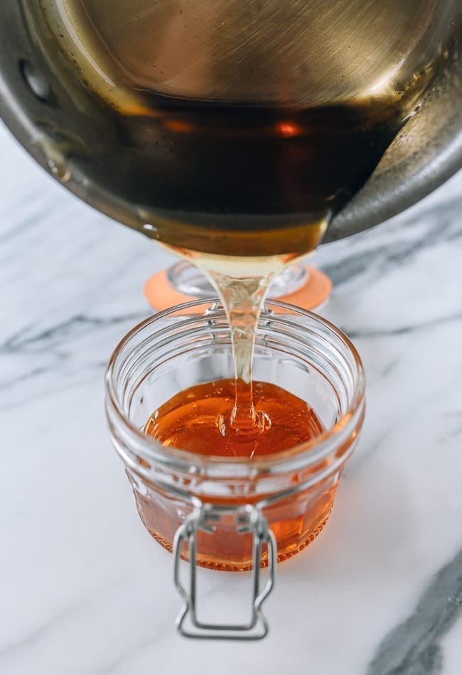 Pouring warm golden syrup into heatproof airtight container, jcghk.dfhdjkvfj.cf