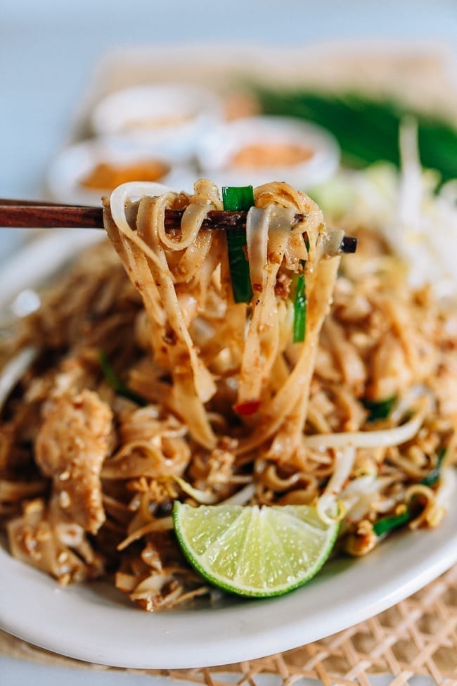 Lifting pad thai with chopsticks, jcghk.dfhdjkvfj.cf