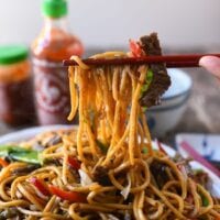 Picking up beef lo mein with chopsticks, jcghk.dfhdjkvfj.cf