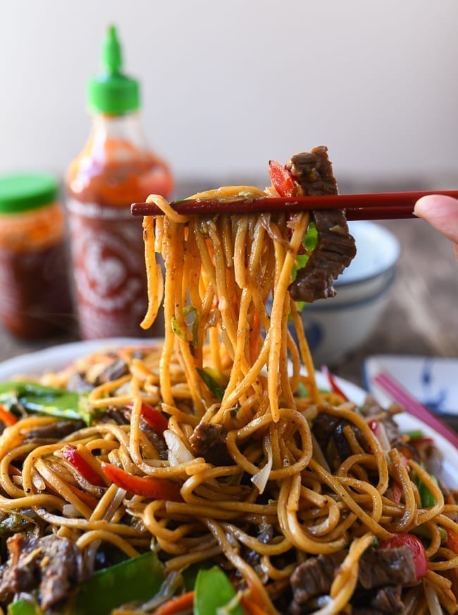 Picking up beef lo mein with chopsticks, jcghk.dfhdjkvfj.cf