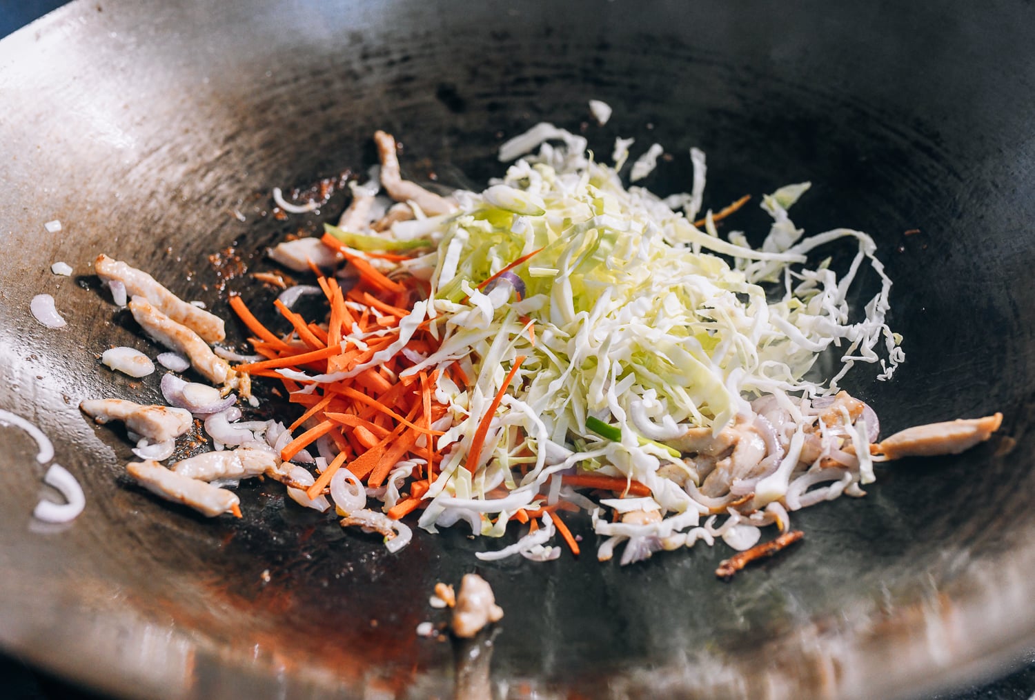 Adding cabbage and carrots to the stir-fry, jcghk.dfhdjkvfj.cf