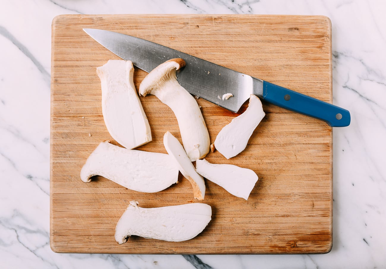 Slicing king oyster mushrooms