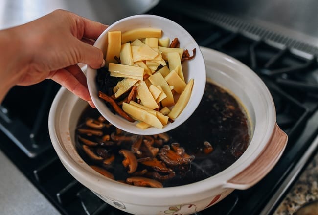 Adding mushrooms, lily flowers, and bamboo shoots to pot of soup, jcghk.dfhdjkvfj.cf
