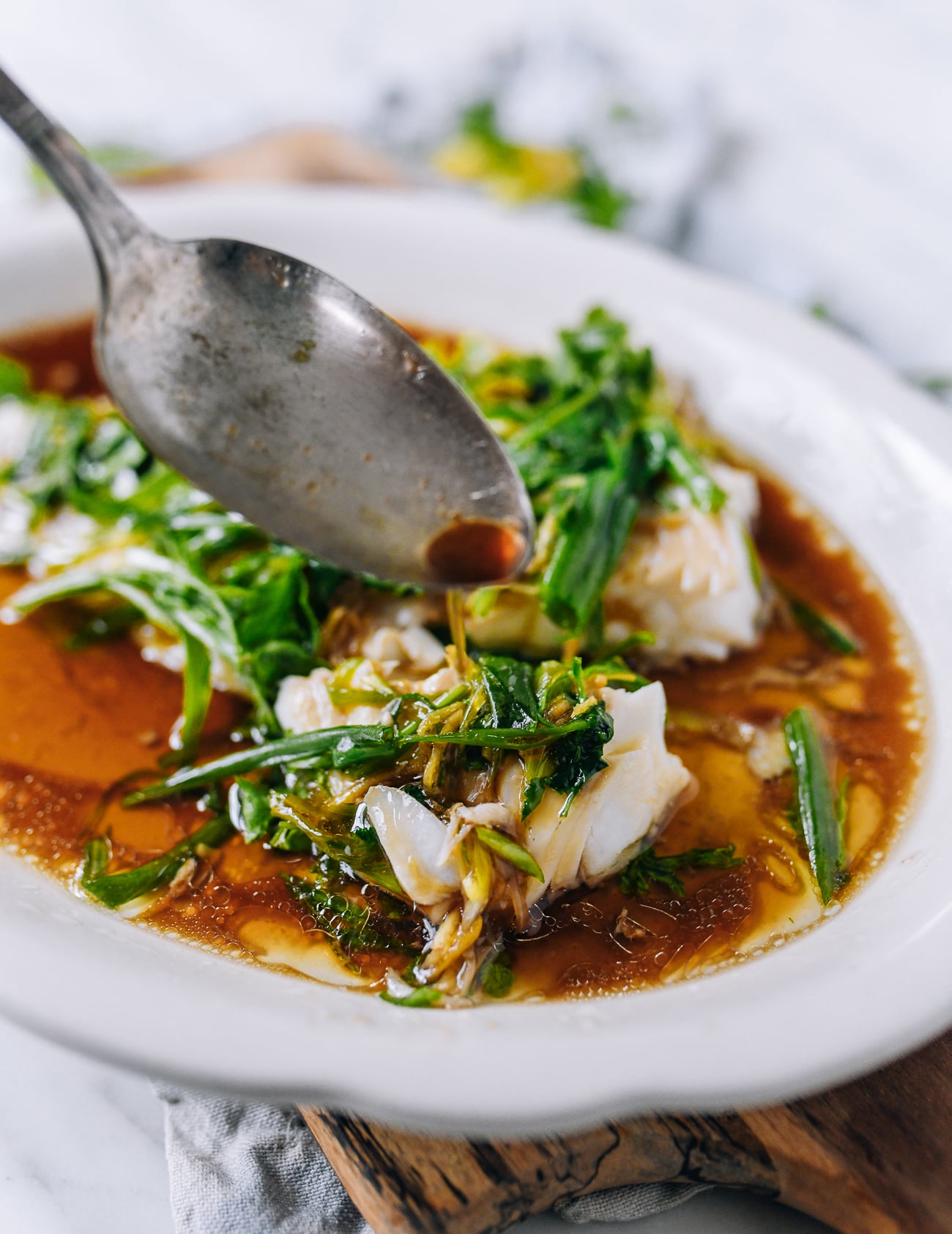 Pouring Sauce over Cantonese Steamed Fish