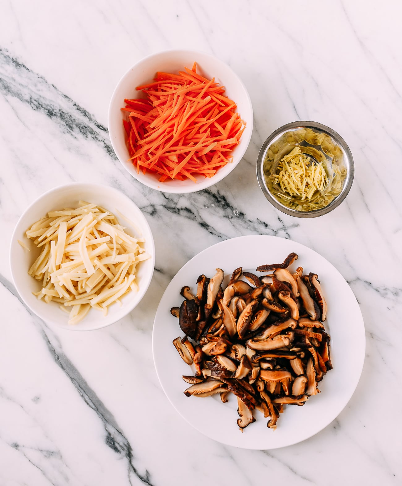 Julienned bamboo shoots, carrots, ginger, and mushrooms