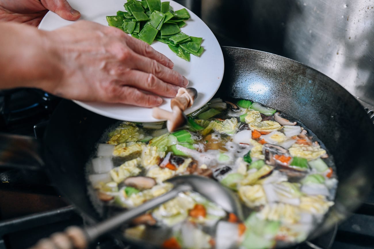 Adding straw mushrooms to soup