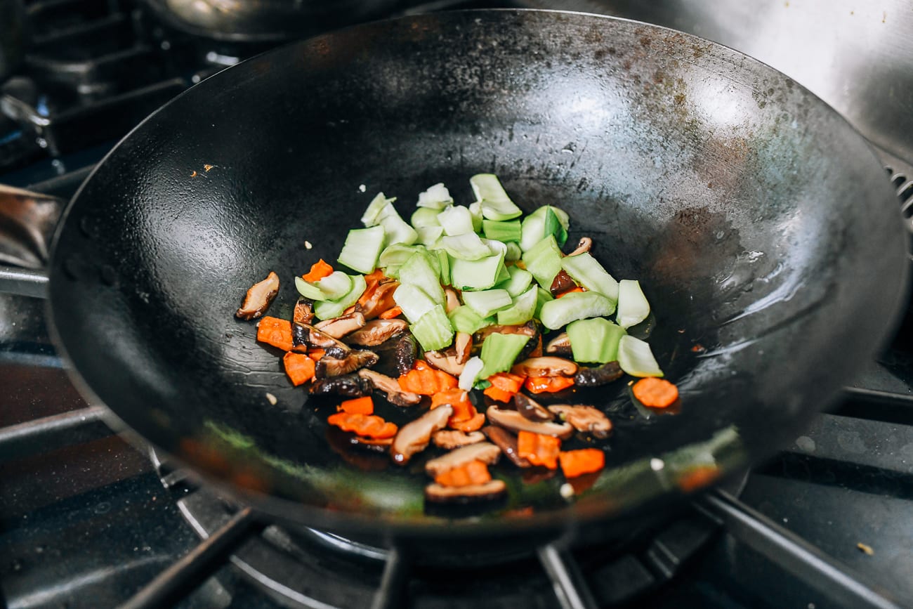 Adding bok choy stems to wok