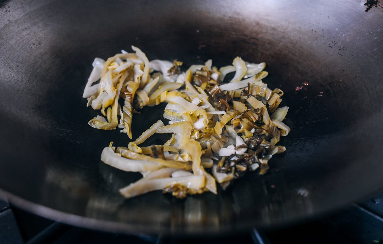 Pickled mustard greens in wok