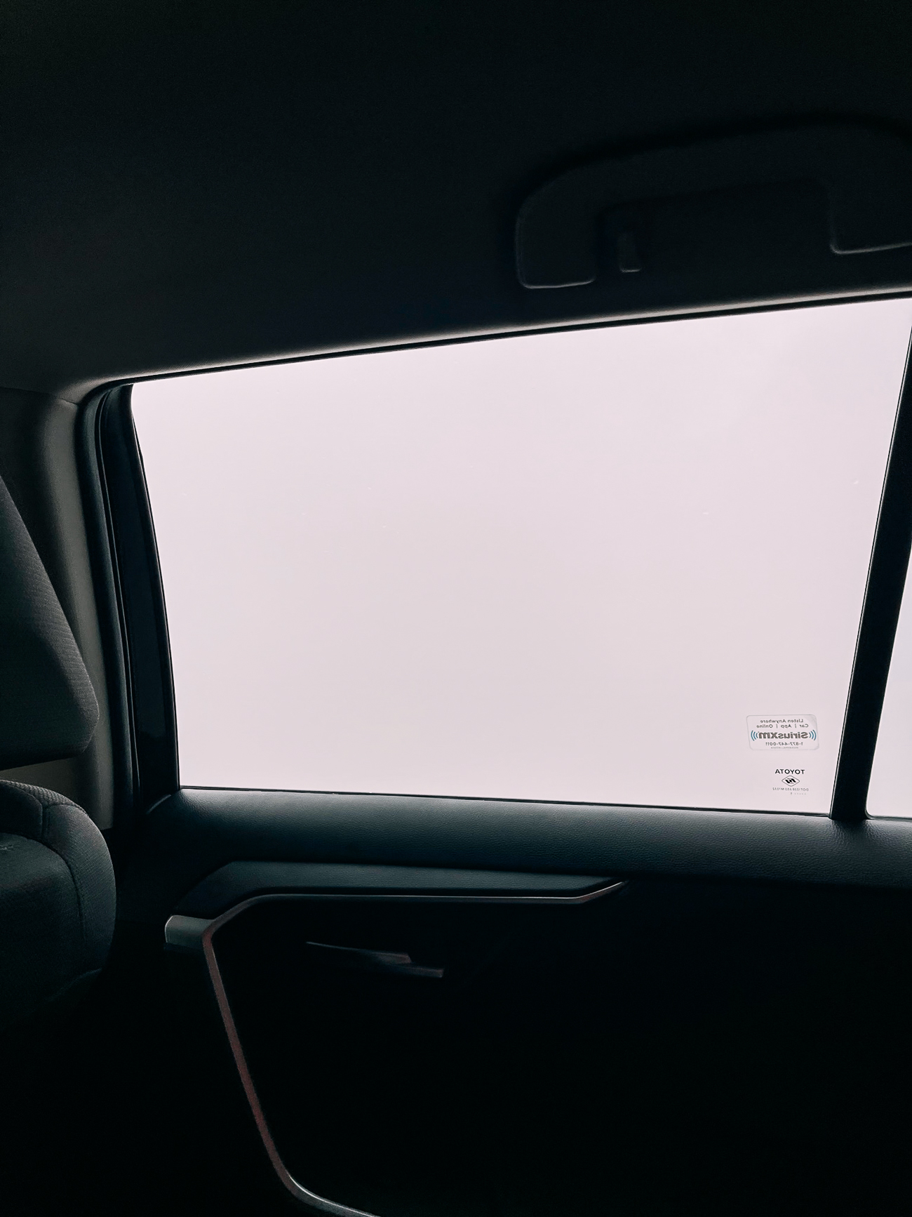View of cloud outside car window. 