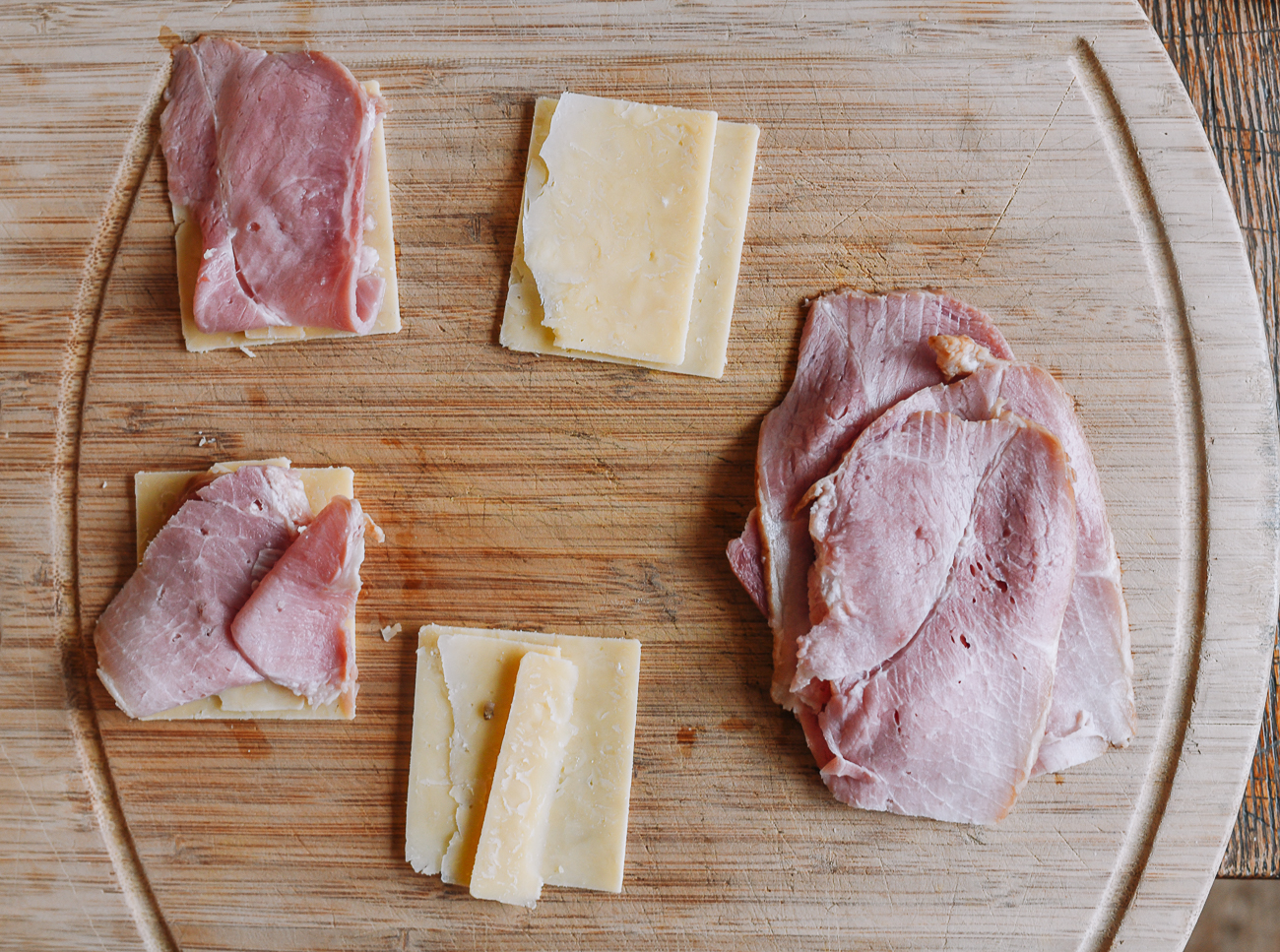 preparing ham and cheese for croissants