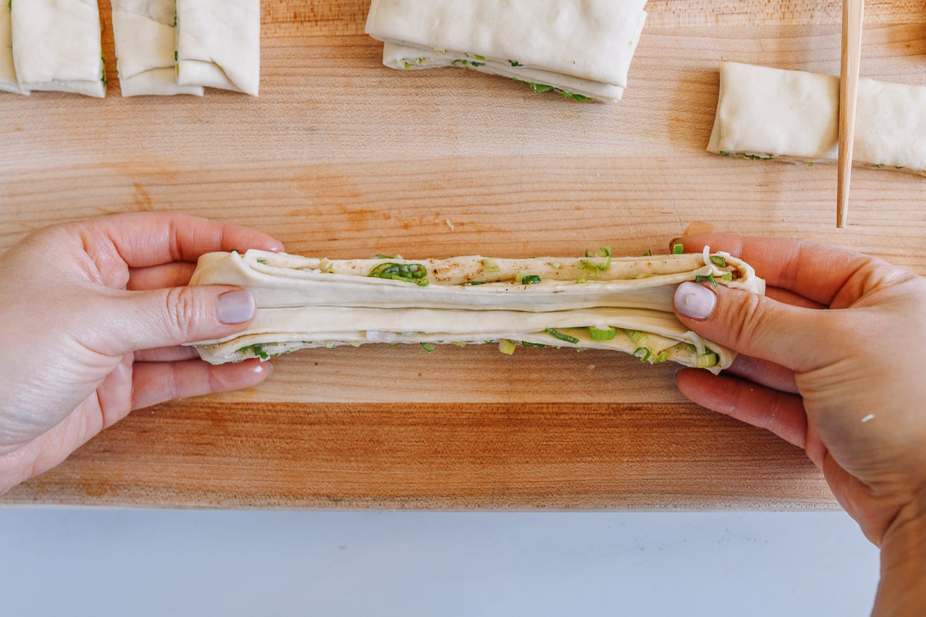 pulling dough to stretch it out