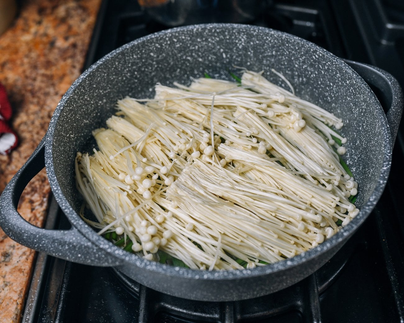 enoki mushrooms in pan