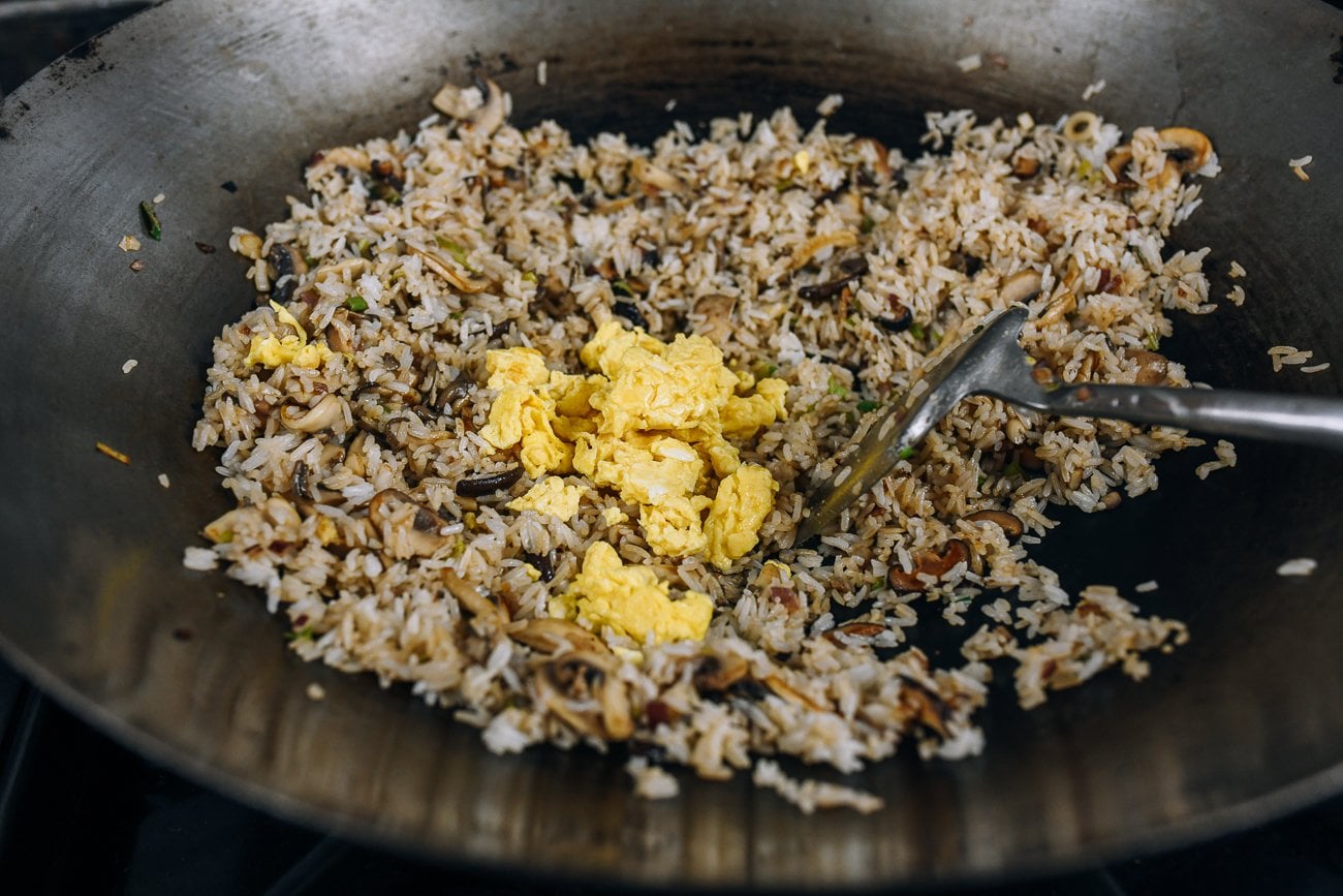 adding egg to rice