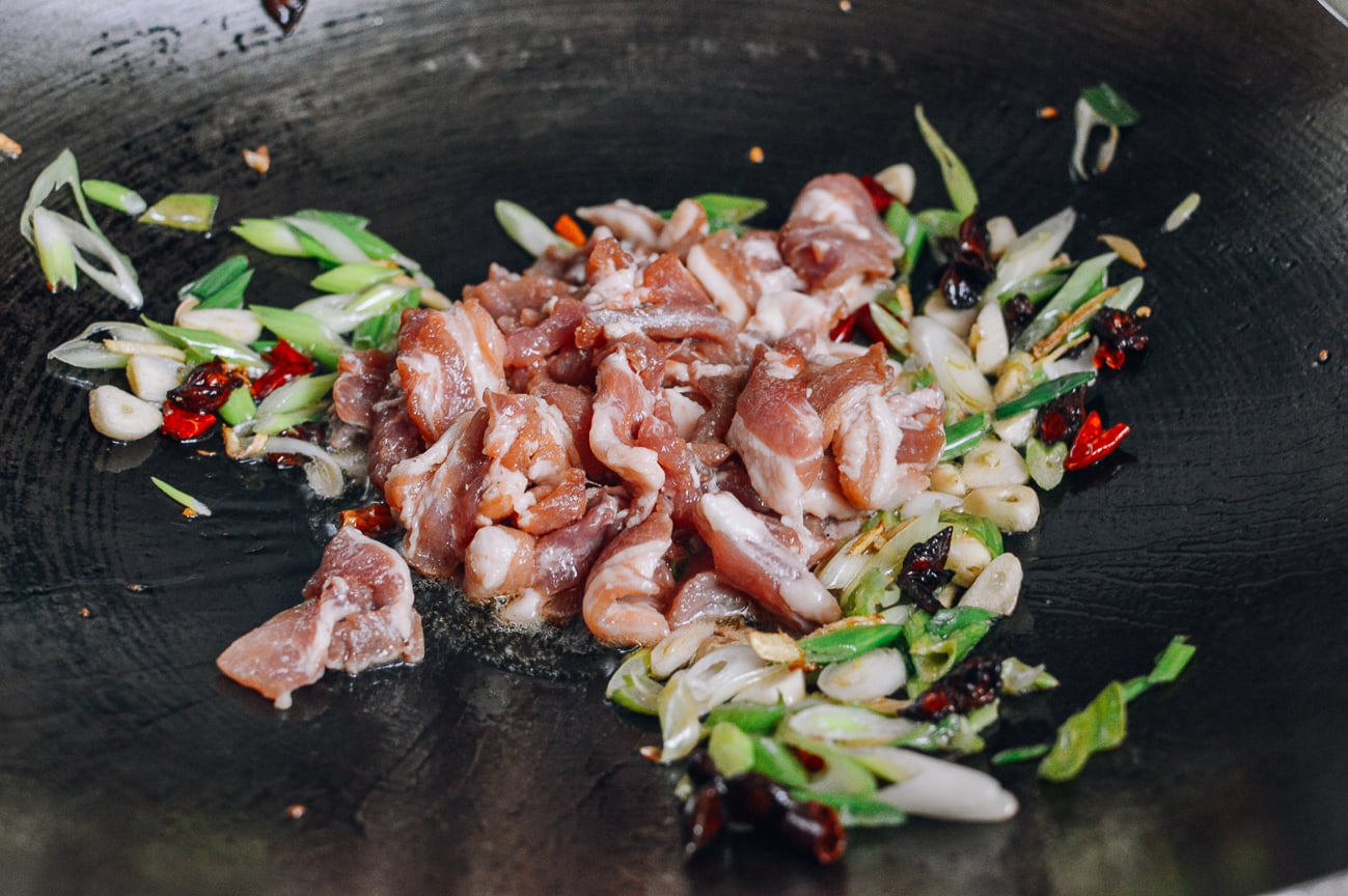 sliced pork belly added to scallions