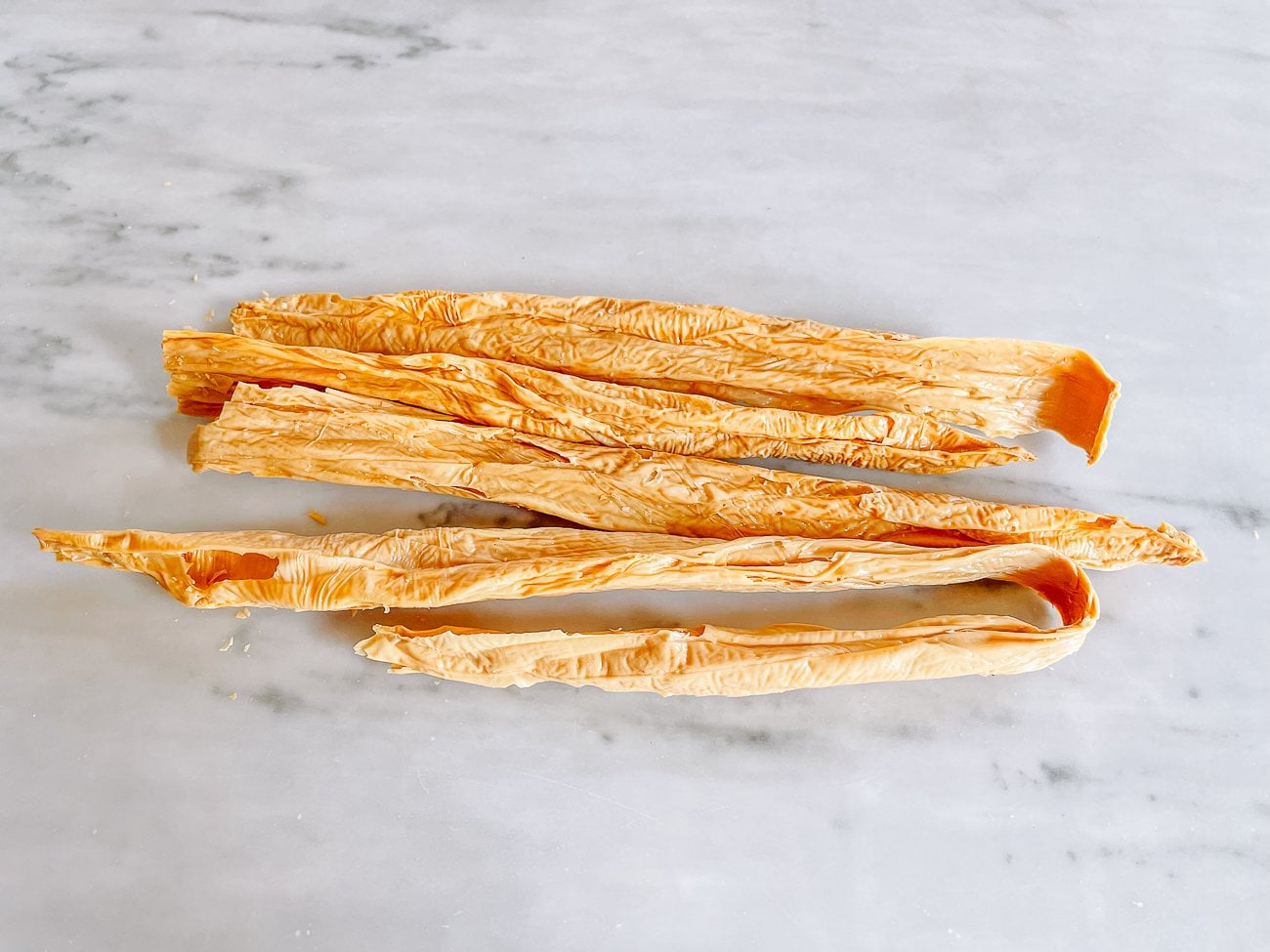 dried bean threads on marble surface