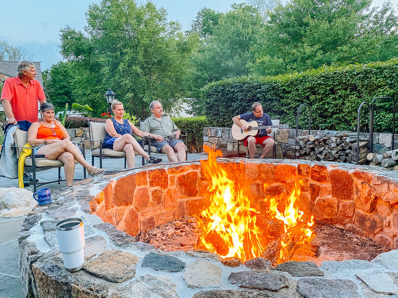 enjoying Chris playing guitar around the firepit