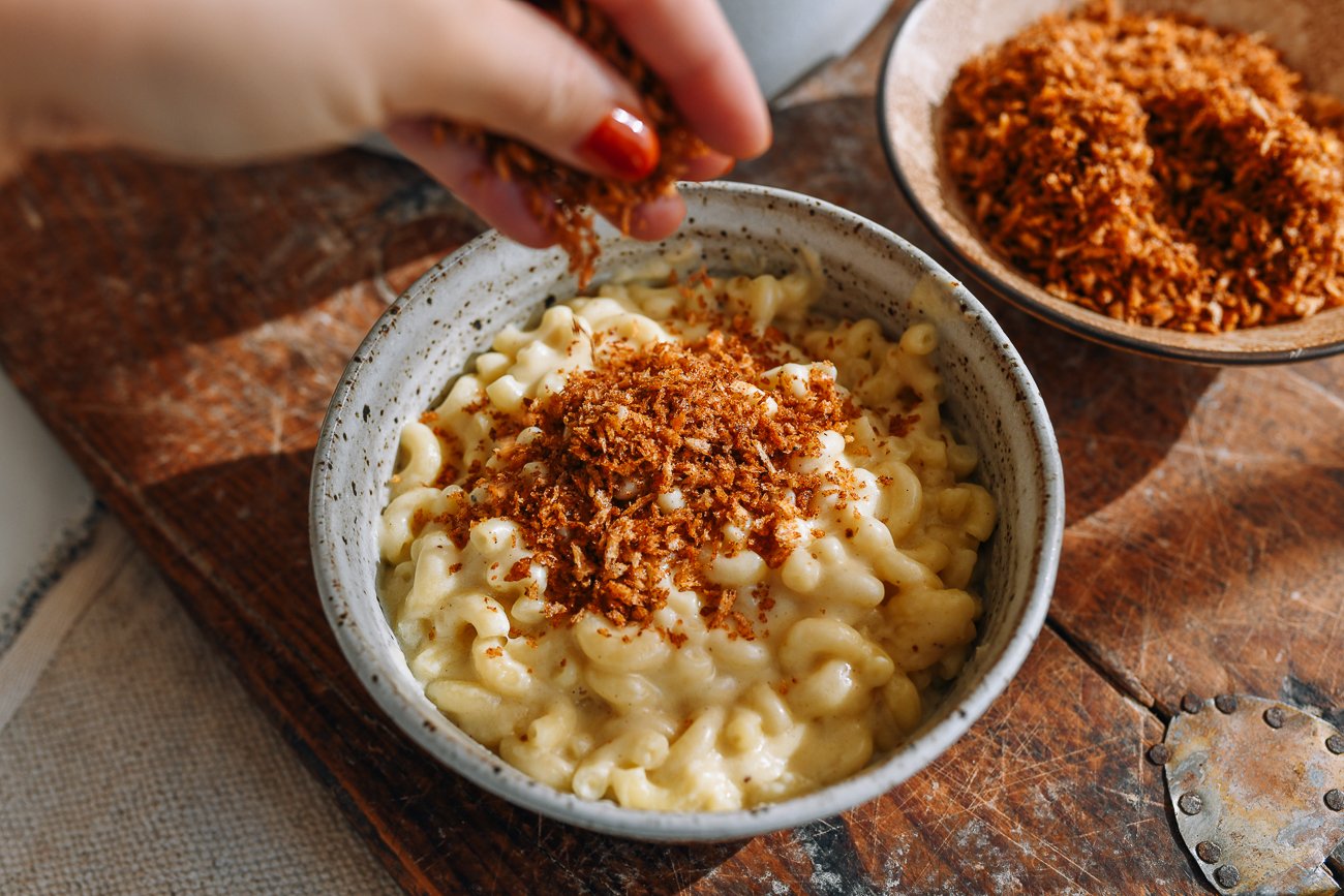 sprinkling panko on top of mac and cheese
