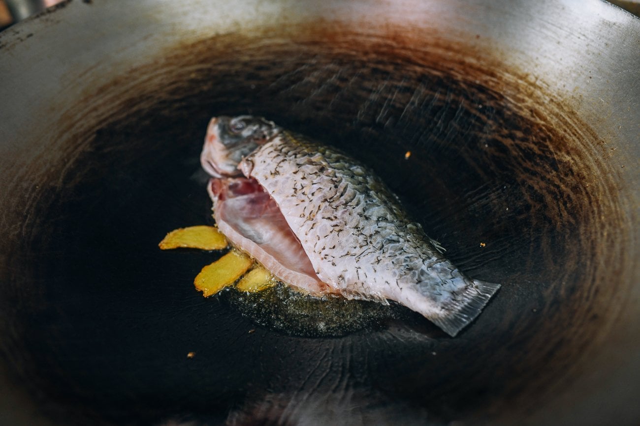 frying carp in wok