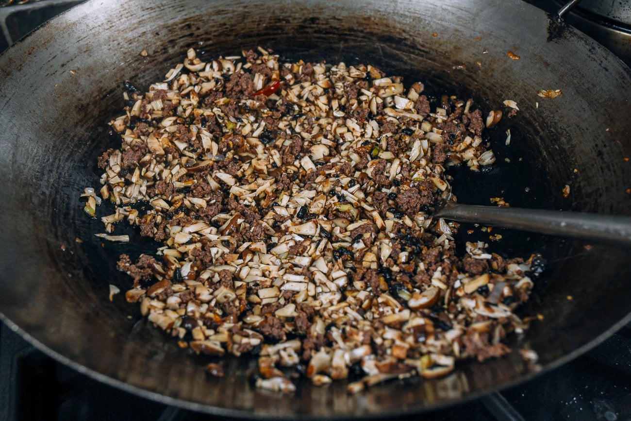 cooking mushrooms down into Chinese meat sauce