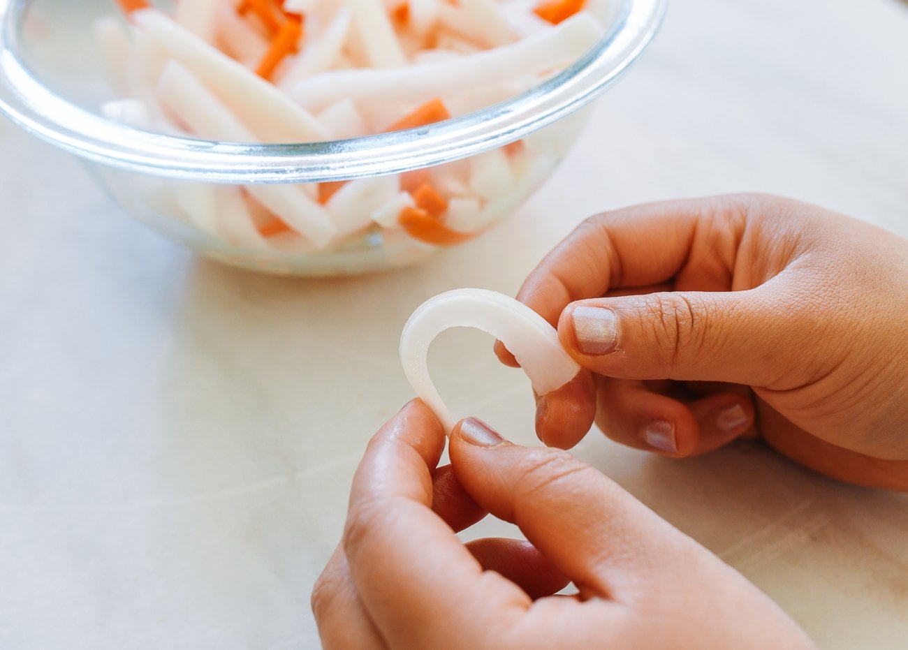 Bending piece of salted daikon radish