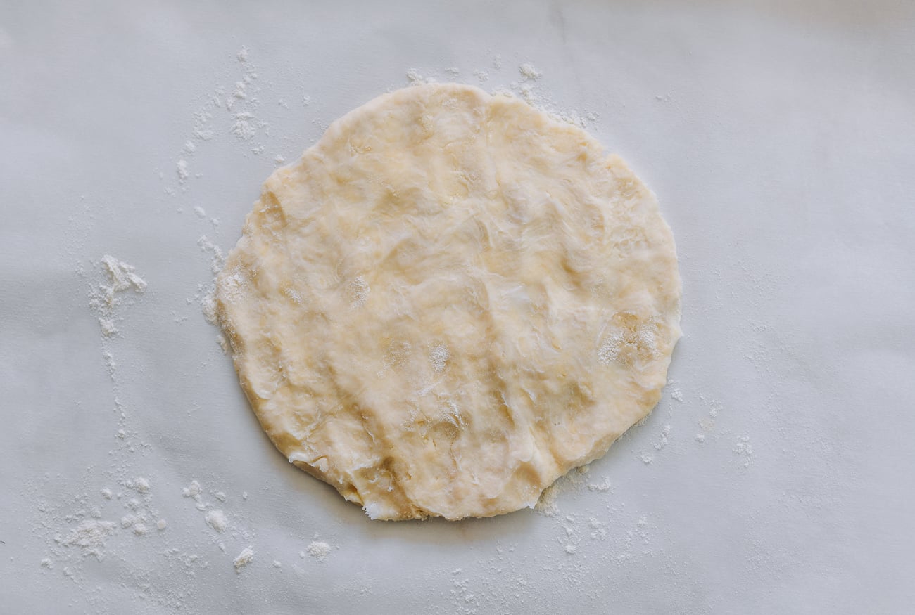 water dough flattened into a disc