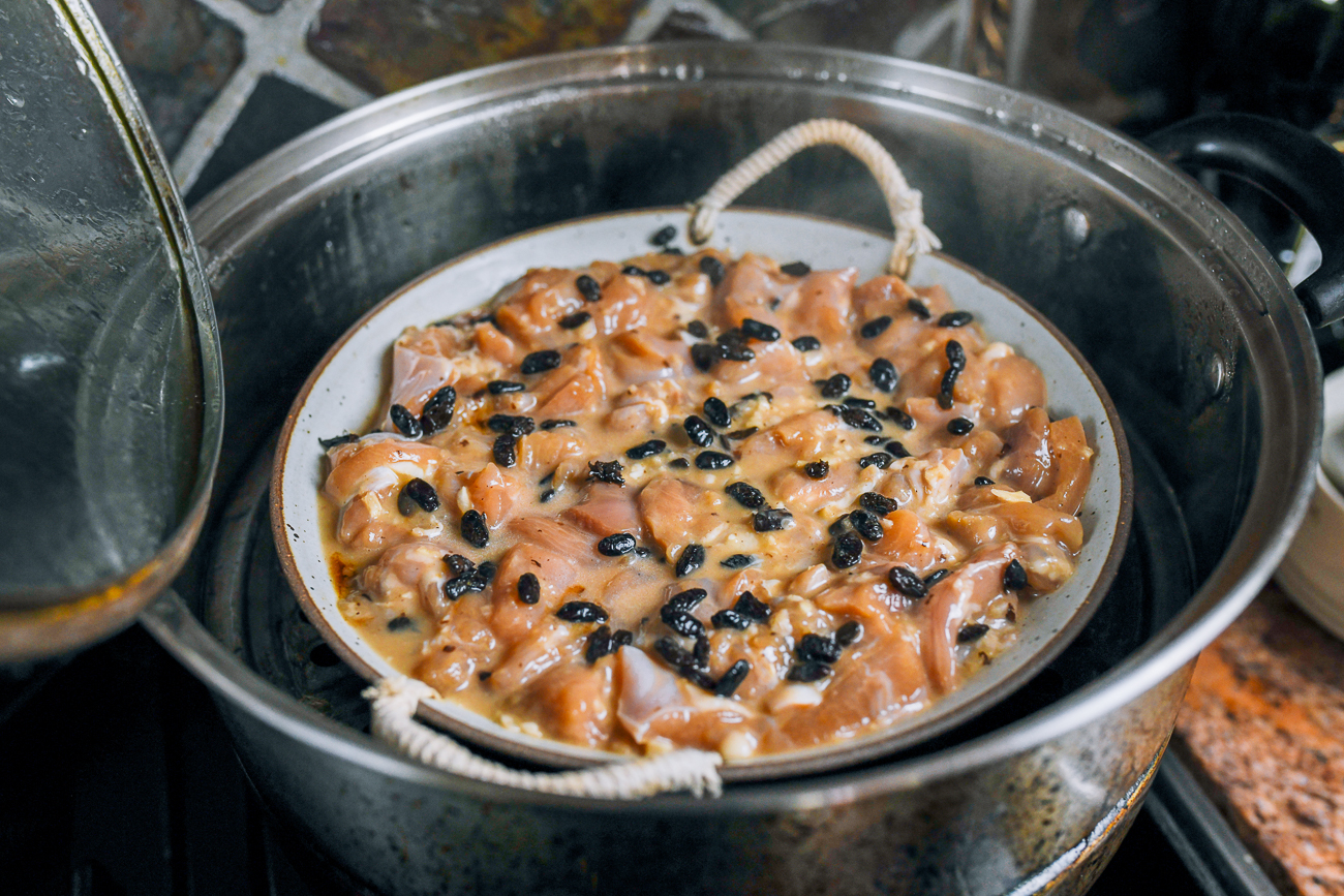 dish of chicken in metal steamer