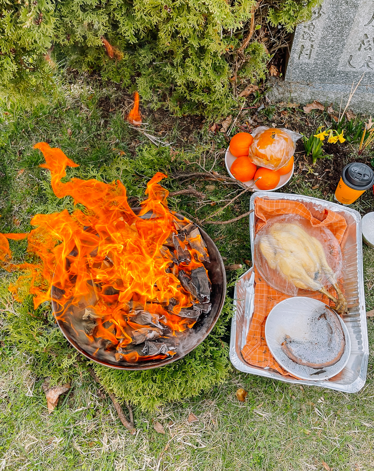 burning joss papers during qingming festival