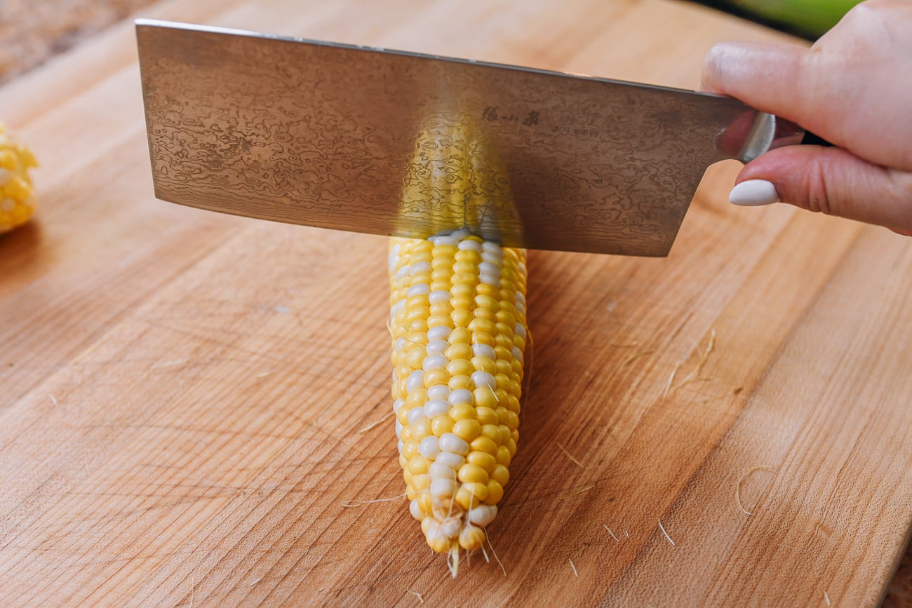 cutting ear of corn in half crosswise
