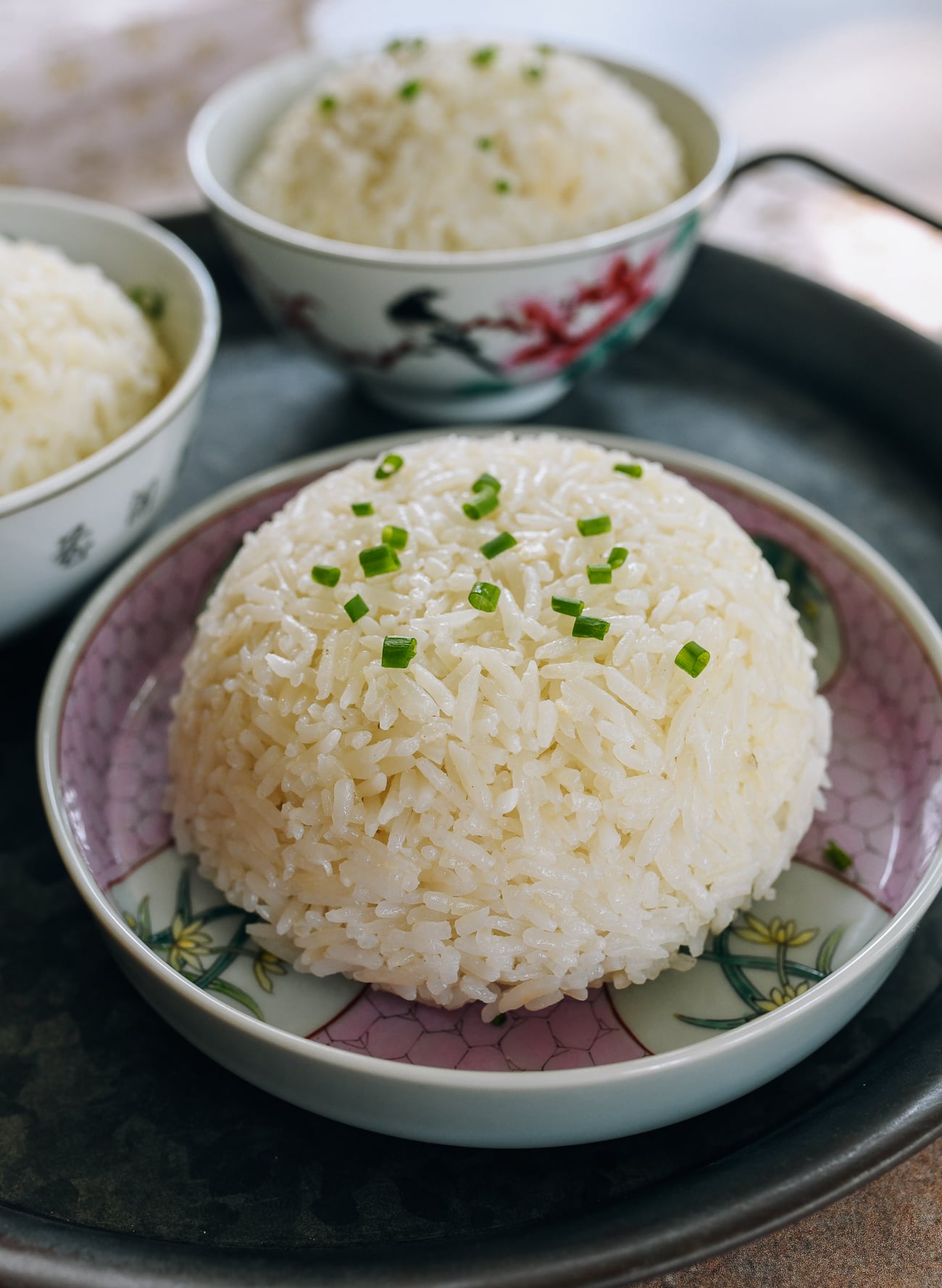 Mound of chicken flavored rice with scallions on top