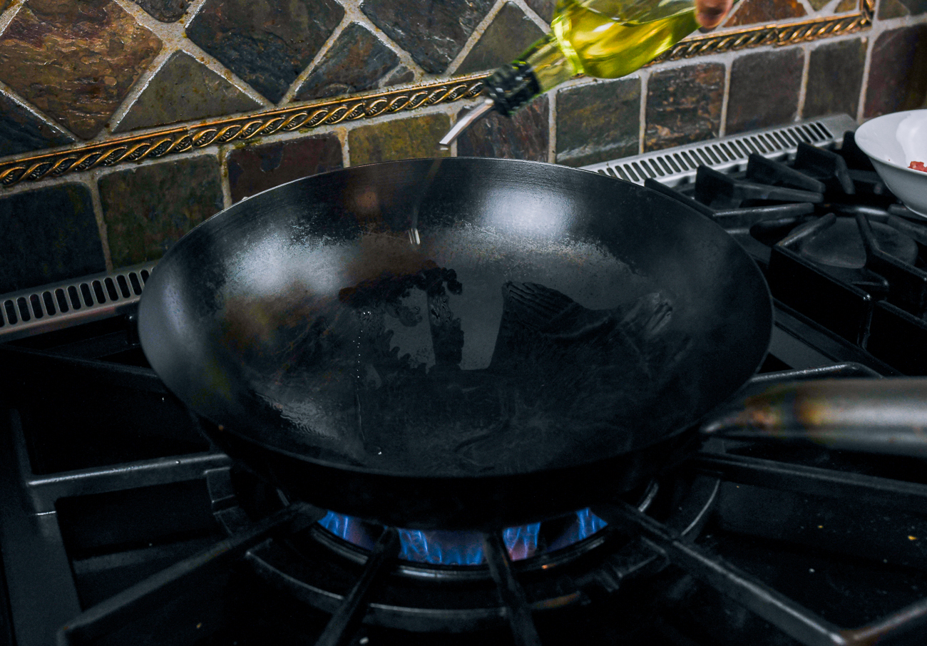 adding cold oil to hot wok