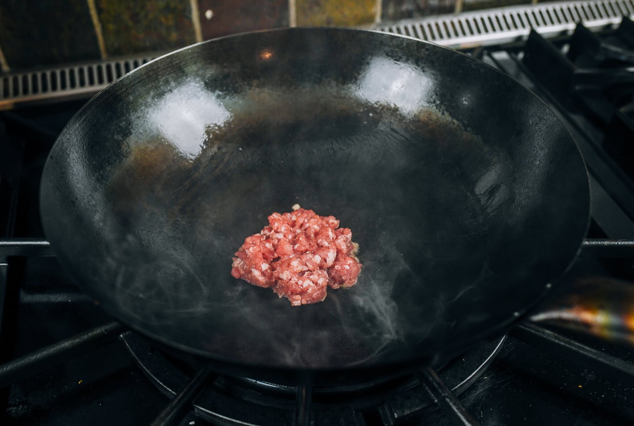 4 ounces ground pork in wok