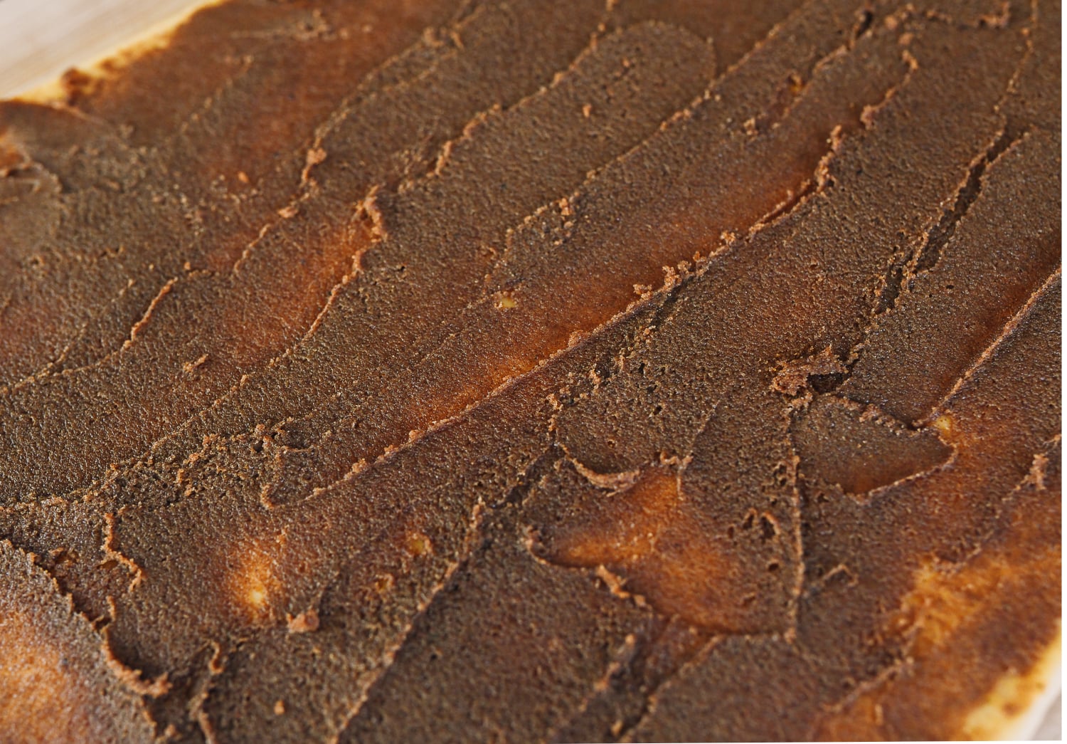 cinnamon roll filling spread out on dough