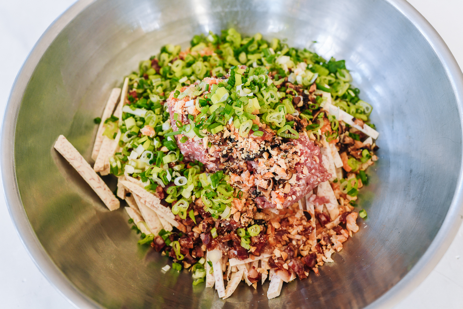 hakka taro roll ingredients in large metal mixing bowl