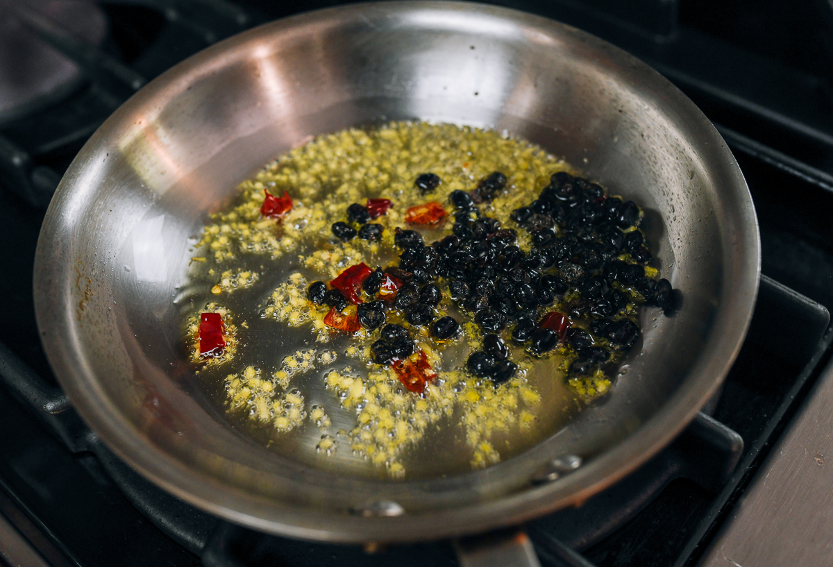 fermented black beans added to ginger and chilies 