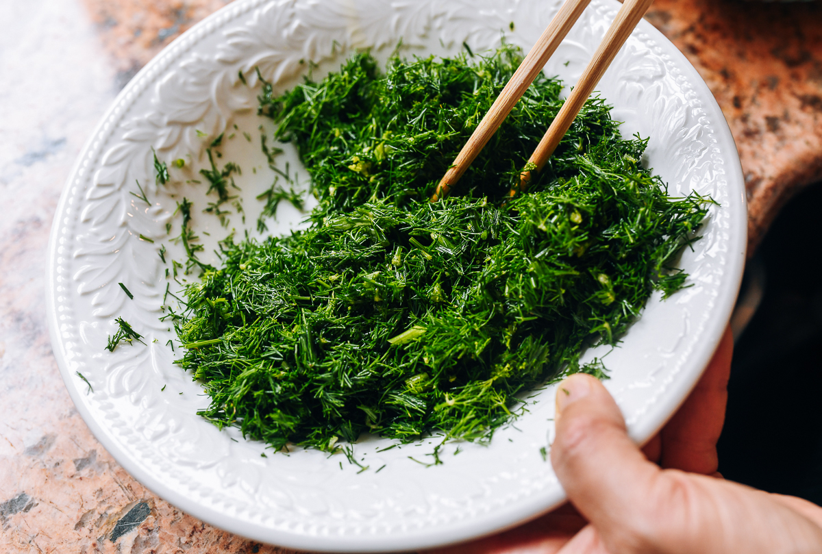 coating chopped dill in oil