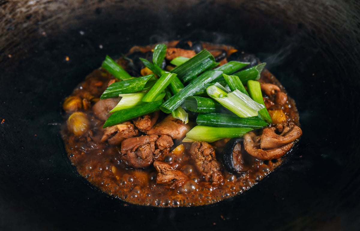 scallions added to chicken with chestnuts