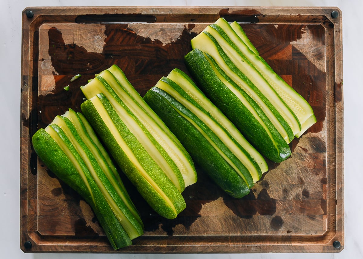 sliced blanched zucchini on cutting board
